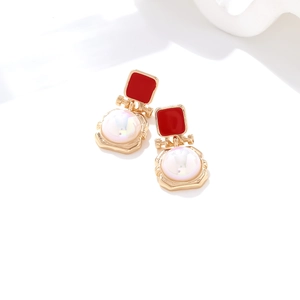 Colorful pearl drop earrings with red enamel squares in a gold-plated geometric setting