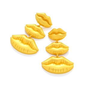 Detailed view of triple-layered golden matte lip-shaped earrings with a stylish finish