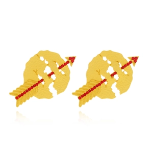 Detailed macro of gold-plated Cupid's arrow earrings featuring red crystal accents