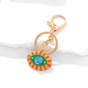 Colorful Evil Eye keychain with blue rhinestone and enamel finish on white stone
