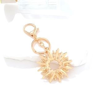 Golden sun pendant keychain with minimalist celestial alloy design and secure clasp