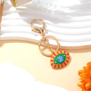 Golden Evil Eye keychain with blue gemstone and colorful enamel decorative pendant