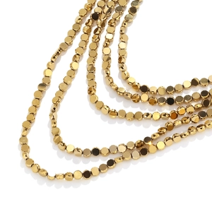 Multi-layer gold waterfall necklace with hexagonal faceted beads and metallic luster