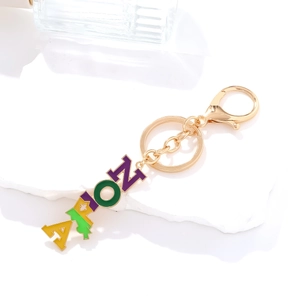 Porte-clés NOLA doré avec breloques en émail coloré pour les fêtes de carnaval