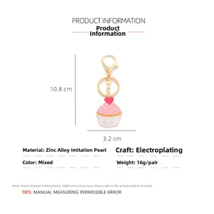 Detailed view of pink enamel cupcake keychain with pearls and zinc alloy dimensions
