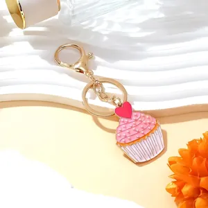 Enamel cupcake keychain with pearl and red heart on wave base