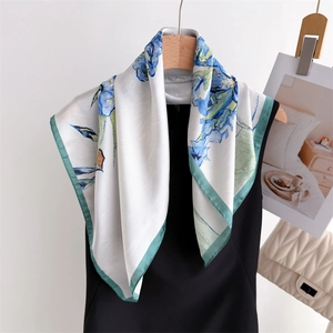 Elegant floral silk square scarf with blue iris print and emerald green borders