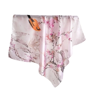 Silk-like scarf featuring elegant flower and bird print on a white background