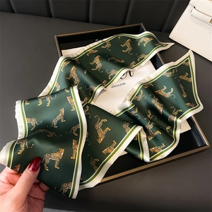Dark green leopard print silk scarf with luxury gold animal patterns and striped borders