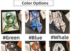 Close-up of assorted patterned silk scarves featuring whale and abstract designs in gift boxes