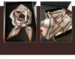 Detailed view of champagne and lilac silk scarf with geometric dots and brown borders