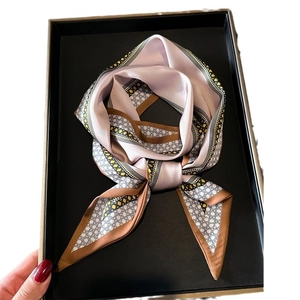 Elegant pale pink silk-like scarf with honeycomb pattern and polka dot trim details