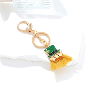 St. Patrick's Day leprechaun keychain with green hat, clover, and yellow silk fringe
