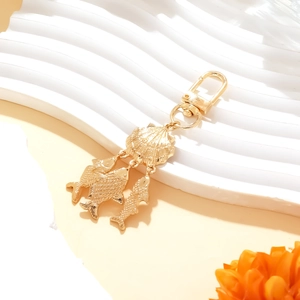 Golden ocean shell and fish charm keychain with starfish and beach style metal pendants