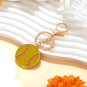 Creative yellow enamel baseball keychain with red stitching and golden lobster clasp