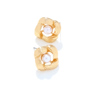 Detail view of gold hollow geometric twist stud earrings with white faux pearl inlay