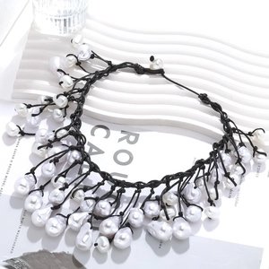 Handmade Baroque pearl knotted necklace with black woven rope for a layered look