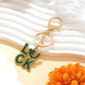 Golden LUCK keychain pendant with green rhinestones and lucky four-leaf clover charm