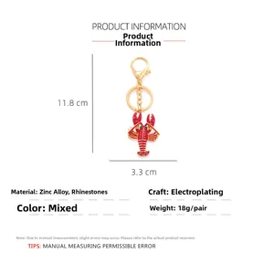 Detailed size chart of red enamel lobster keychain with rhinestones and gold alloy