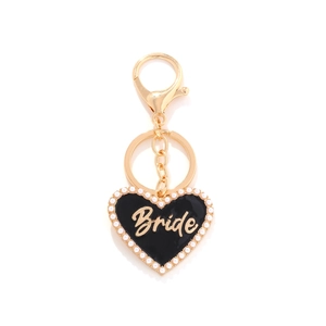 Golden heart keychain with black enamel Bride lettering and white pearl edge decoration
