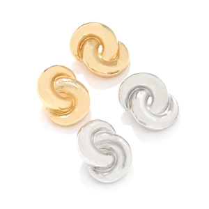 Close-up of chunky gold and silver twisted knot stud earrings with metallic finish