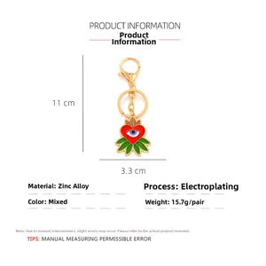 Detail view of colorful enamel evil eye keychain with heart charm and size dimensions