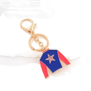 Blue and red jockey silk keychain with a gold star and pink rhinestones on a stone base