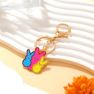 Colorful Easter rabbit enamel keychain with blue pink yellow bunny charms on gold hook