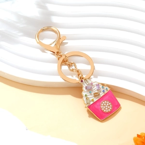 Pink enamel cupcake keychain with colorful rhinestones and white pearl on gold ring