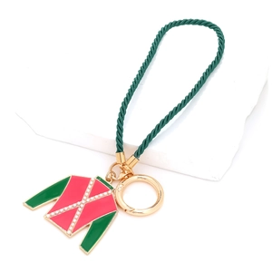 Equestrian jacket keychain with dark green woven rope and gold ring pendant