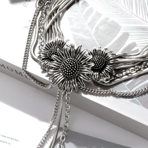 Elegant multi-layer vintage silver necklace with three textured daisy pendants