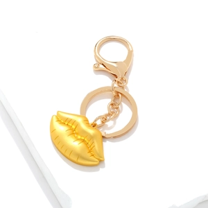 Portachiavi creativo con ciondolo a labbra oro opaco e chiusura a moschettone su pietra