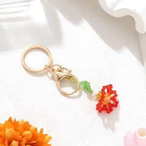 Handmade crystal carnation flower keychain with red beads and golden metal ring