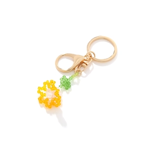 Handmade beaded crystal carnation flower keychain with yellow petals and gold metal clasp