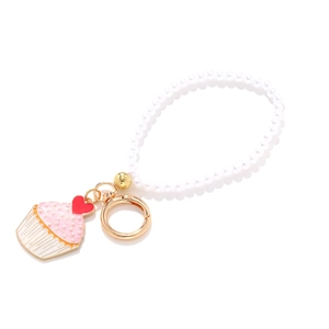 Chic beaded keychain with pink enamel cupcake pendant and red heart detail for bags