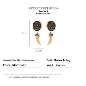 Detail view of oval horn drop earrings with rhinestones showing 6cm length and zinc alloy specs