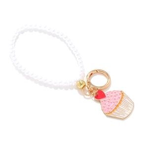 Cute enamel cupcake pendant keychain with white faux pearls and pink heart cream detail