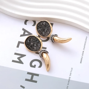 Vintage style gold horn earrings with black pavé crystals and oval diamond studs