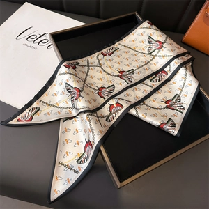 Close-up of lightweight silk-like scarf with butterfly print and black rolled edges