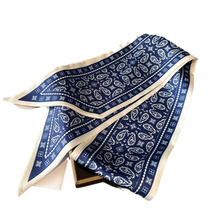 Elegant navy paisley long silk scarf with white borders and geometric patterns in a gift box