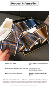 Detail of a geometric pattern double-layered silk-feel scarf on a tray with a magazine