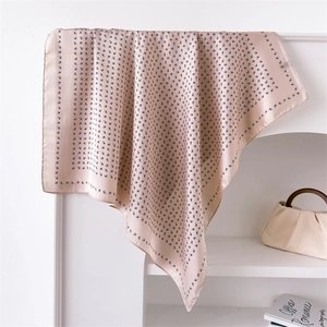 70cm champagne paisley silk satin square scarf draped on a white shelf for women