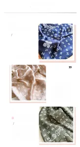 Close-up of paisley print and fine stitching on the 70cm silk-like satin neck scarf
