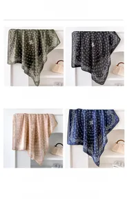 Detailed color display of four paisley silk-like square scarves in olive, black, khaki, and navy