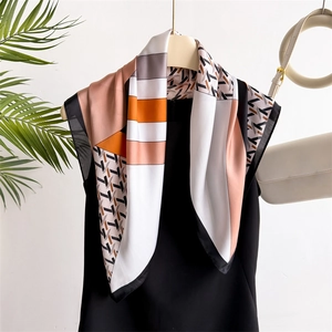 Elegant houndstooth silk-like small square scarf with orange and pink geometric patterns