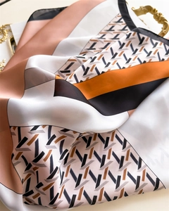 Detailed view of luxury geometric chain pattern on elegant satin silk square scarf