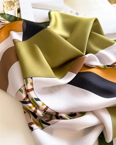 Close-up of silky houndstooth square scarf with modern geometric abstract pattern
