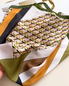 Detail of satin houndstooth scarf showing glossy fabric texture and geometric pattern