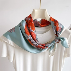 Floral satin square scarf with chrysanthemum print styled on a mannequin neck