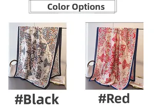 Detail view of two silk-like scarves featuring paisley prints in black and red colors